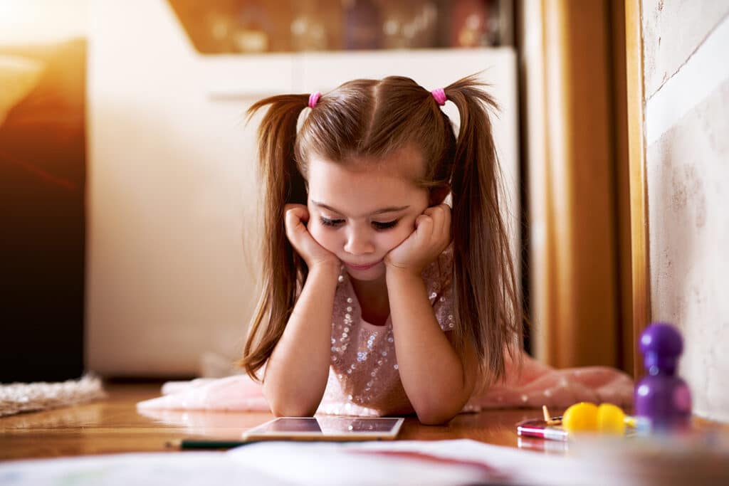 little girl watching ipad