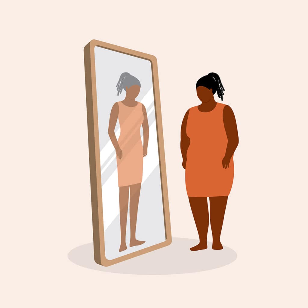 woman looking in a warped mirror