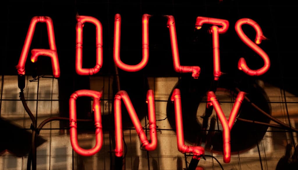 neon sign that says adults only